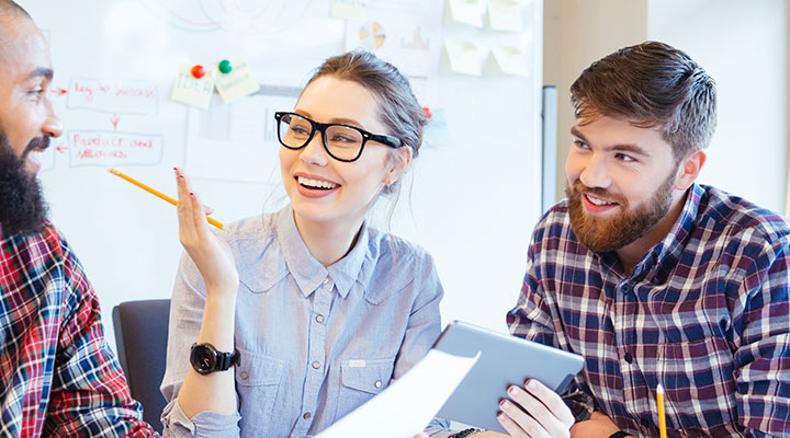 Group discussion around a table in office