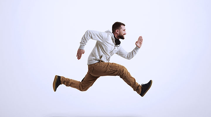 Man in mid air running pose 