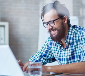 Man working on laptop in office 